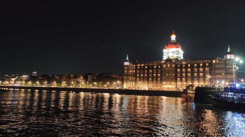 Majestically lit Taj hotel at night - View from a ferry on the Sea